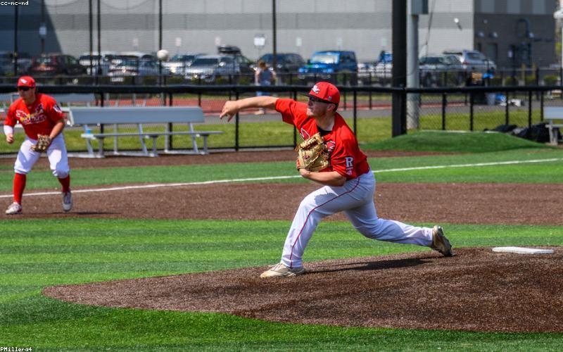 A refreshing glass of water with lemon and mint, next to a pitcher.