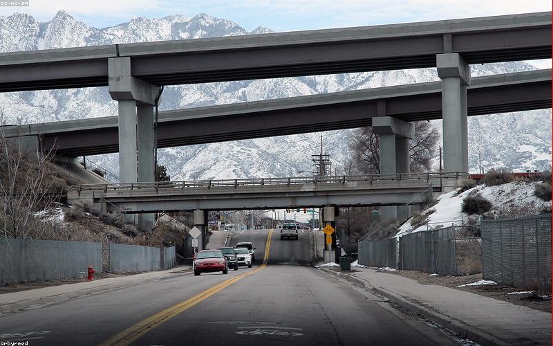 Group of friends taking a selfie with a modern smartphone, vibrant Lahore street in the background.