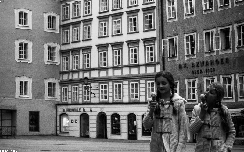 A family or friends gathered around a table, enjoying the Karahi, looking happy and satisfied.