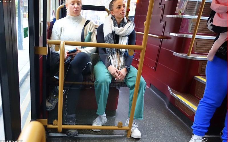 A cozy, aesthetically designed modern chai cafe interior with ambient lighting and people chatting