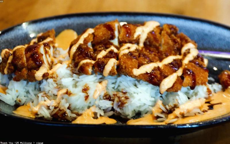 A spread of a healthy Iftar table with fruits, dates, water, a bowl of lentil soup, and a small portion of a main dish