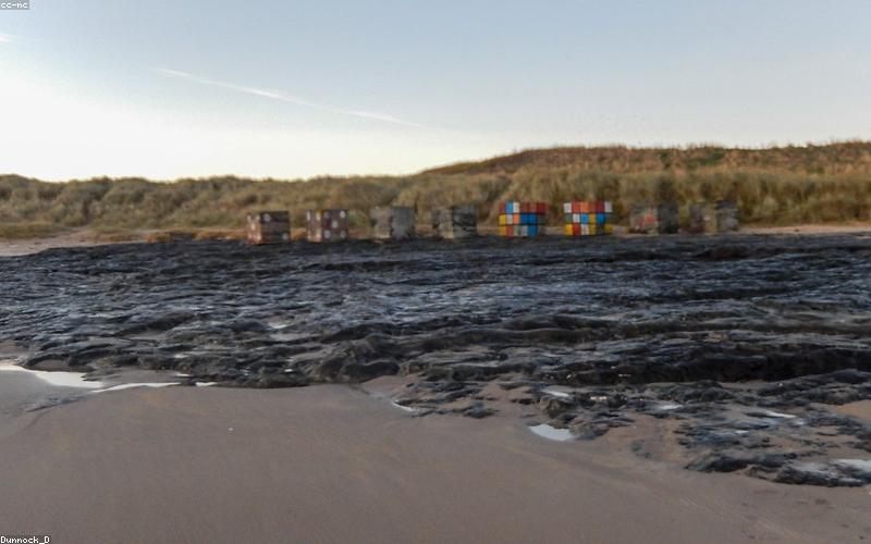 A refreshing glass of lemon and mint infused water with ice cubes
