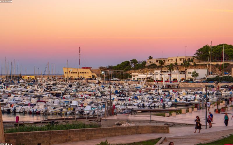 A phone charging rapidly with a fast charger, showing a high charging percentage and a happy person checking it.