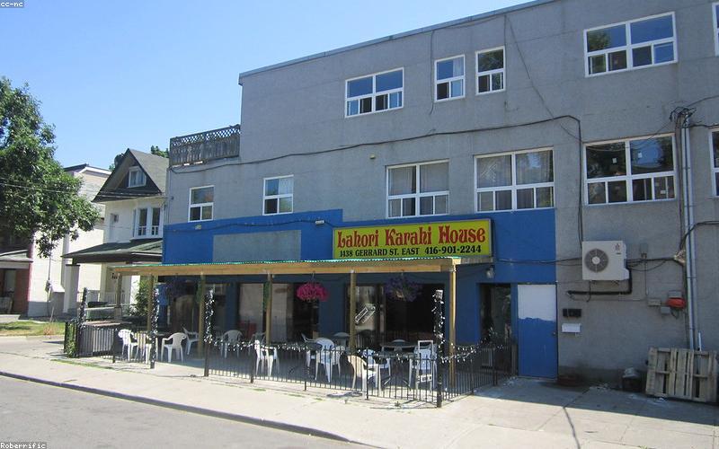 Chopped tomatoes cooking with ginger-garlic paste and spices in a karahi