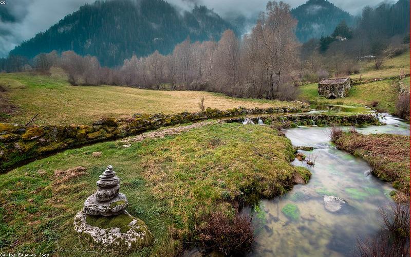 People enthusiastically using smartphones, perhaps gaming or streaming with a futuristic background
