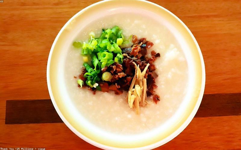 A beautifully arranged Iftar table with dates, fruit chaat, a bowl of lentil soup, a plate of grilled chicken, and glasses of water, showing a balanced meal.