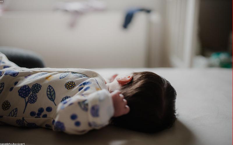 A happy Pakistani family enjoying their home with solar panels installed on the roof, smiling and relaxed.