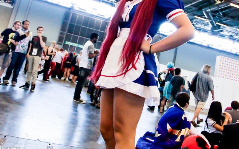 Young Pakistani tech entrepreneurs presenting their innovative project on a large screen at a local tech expo