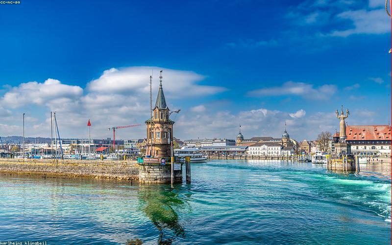 A beautifully arranged Iftar table with dates, a bowl of fresh fruit chaat, a light lentil soup, and a jug of lemon-mint water.