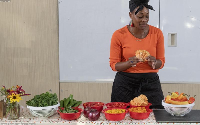 A vibrant, close-up shot of heavily loaded fries with different toppings like grilled chicken, sauces, and finely chopped veggies.