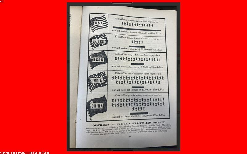 A bustling Pakistani market stall displaying various models of lithium batteries for solar and UPS, with customers looking at prices.