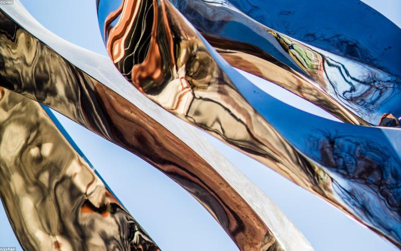 A person intensely gaming on a sleek smartphone, showcasing high-refresh-rate display and powerful graphics