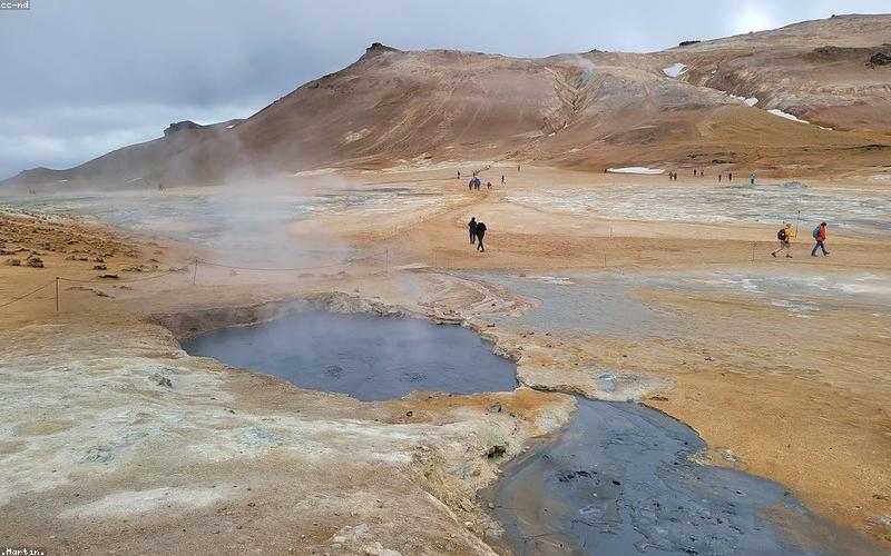 Chicken cooking in the karahi with tomatoes and spices, bubbling