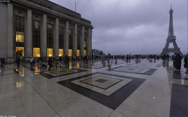 Photo of a vibrant chai dhaba in Lahore, packed with people enjoying chai and conversation under colorful lights.