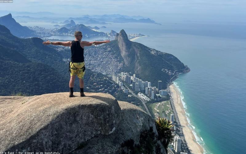 A person carrying a water bottle and another drinking coconut water.