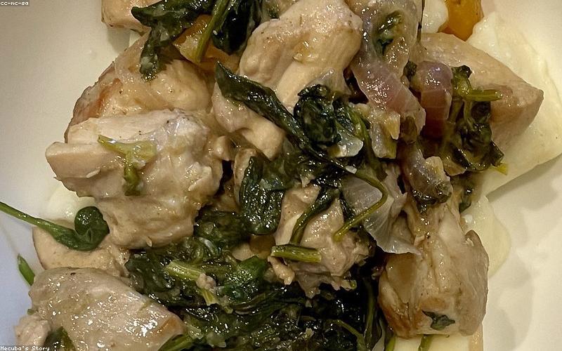 Close-up of finished Chicken Karahi garnished with coriander.