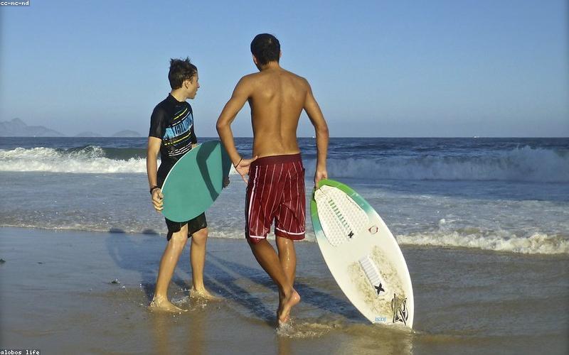 A futuristic solar-powered electric car driving down a highway, with solar panels integrated into its roof and body.